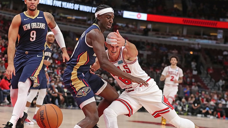 Oct 8, 2021; Chicago, Illinois, USA; Chicago Bulls guard Alex Caruso (6) collides with New Orleans Pelicans guard Kira Lewis Jr. (13) during the second half at the United Center. Mandatory Credit: Dennis Wierzbicki-USA TODAY Sports