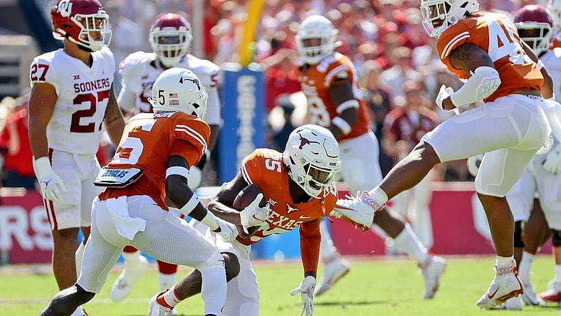 Oct 9, 2021; Dallas, Texas, USA; Texas Longhorns defensive back B.J. Foster (25) reacts after intercepting a pass against the Oklahoma Sooners during the first quarter at the Cotton Bowl. Mandatory Credit: Kevin Jairaj-USA TODAY Sports