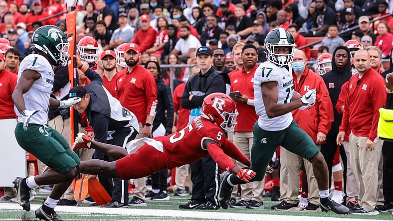 Oct 9, 2021; Piscataway, New Jersey, USA; Michigan State Spartans wide receiver Tre Mosley (17) is tackled by Rutgers Scarlet Knights defensive back Kessawn Abraham (5) during the first half at SHI Stadium. Mandatory Credit: Vincent Carchietta-USA TODAY Sports
