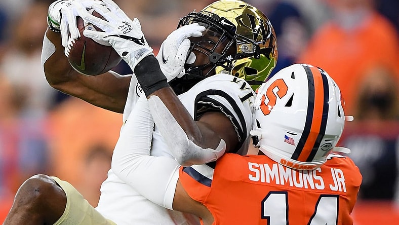Oct 9, 2021; Syracuse, New York, USA; Wake Forest Demon Deacons wide receiver Jaquarii Roberson (5) catches the ball as Syracuse Orange defensive back Jason Simmons (14) defends during the first half at the Carrier Dome. Mandatory Credit: Rich Barnes-USA TODAY Sports