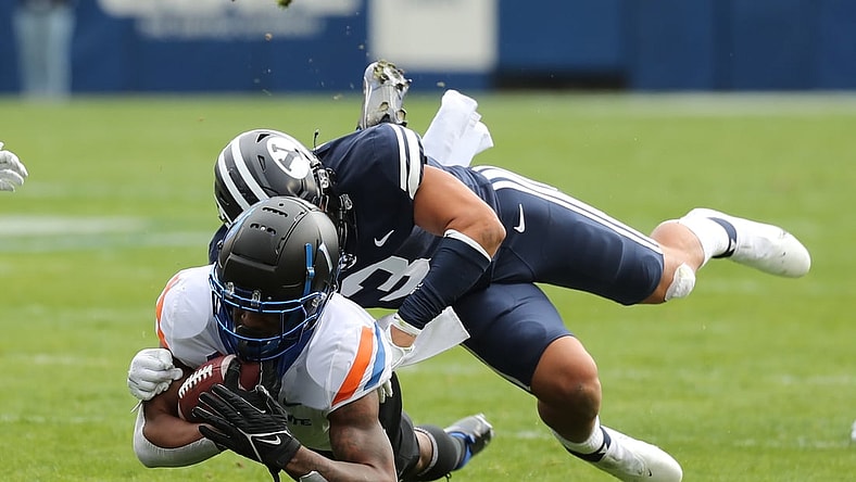 Oct 9, 2021; Provo, Utah, USA; Boise State Broncos wide receiver Octavius Evans (1) is tackled by Brigham Young Cougars linebacker Chaz Ah You (3) during the first quarter at LaVell Edwards Stadium. Mandatory Credit: Rob Gray-USA TODAY Sports