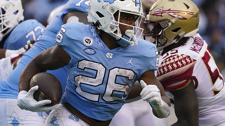 Oct 9, 2021; Chapel Hill, North Carolina, USA; North Carolina Tar Heels running back D.J. Jones (26) runs with the ball during the first half against the Florida State Seminoles at Kenan Memorial Stadium. Mandatory Credit: James Guillory-USA TODAY Sports
