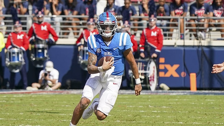 Oct 9, 2021; Oxford, Mississippi, USA; Mississippi Rebels quarterback Matt Corral (2) carries the ball against Arkansas Razorbacks at Vaught-Hemingway Stadium. Mandatory Credit: Marvin Gentry-USA TODAY Sports