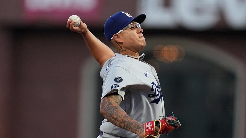 Oct 9, 2021; San Francisco, California, USA; Los Angeles Dodgers starting pitcher Julio Urias (7) throws against the San Francisco Giants in the first inning during game two of the 2021 NLDS at Oracle Park. Mandatory Credit: Neville E. Guard-USA TODAY Sports