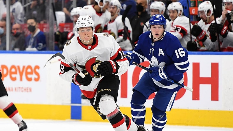 Oct 9, 2021; Toronto, Ontario, CAN;   Ottawa Senators forward Tim Stutzle (18) pursues the play ahead of Toronto Maple Leafs forward Mitch Marner (16) in the third period at Scotiabank Arena. Mandatory Credit: Dan Hamilton-USA TODAY Sports