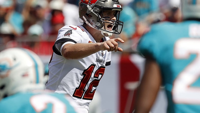 Oct 10, 2021; Tampa, Florida, USA; Tampa Bay Buccaneers quarterback Tom Brady (12) throws the ball against the Miami Dolphins during the first half at Raymond James Stadium. Mandatory Credit: Kim Klement-USA TODAY Sports
