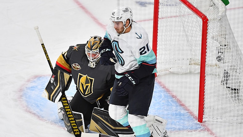 Oct 12, 2021; Las Vegas, Nevada, USA; Vegas Golden Knights goaltender Robin Lehner (90) protects his net as Seattle Kraken center Alex Wennberg (21) waits to deflect an incoming shot during the first period at T-Mobile Arena. Mandatory Credit: Stephen R. Sylvanie-USA TODAY Sports
