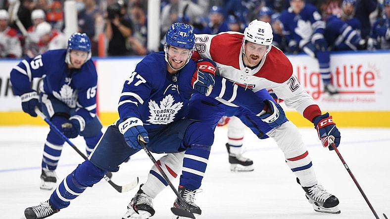 Oct 13, 2021; Toronto, Ontario, CAN;   Toronto Maple Leafs forward Pierre Engvall (47) pursues the puck ahead of Montreal Canadiens defenseman Jeff Petry (26) n the second period at Scotiabank Arena. Mandatory Credit: Dan Hamilton-USA TODAY Sports