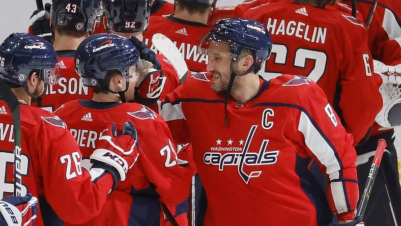 Oct 13, 2021; Washington, District of Columbia, USA; Washington Capitals left wing Alex Ovechkin (8) celebrates with Capitals center Hendrix Lapierre (29) after their game against the New York Rangers at Capital One Arena. Mandatory Credit: Geoff Burke-USA TODAY Sports