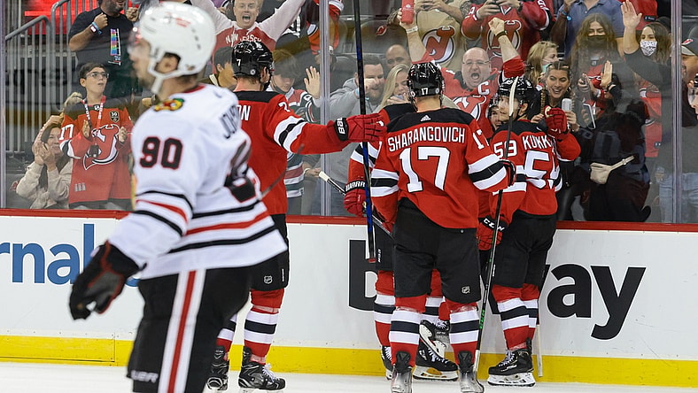 Oct 15, 2021; Newark, New Jersey, USA; New Jersey Devils center Jack Hughes (86) celebrates his goal with teammates during the second period against the Chicago Blackhawks at Prudential Center. Mandatory Credit: Vincent Carchietta-USA TODAY Sports