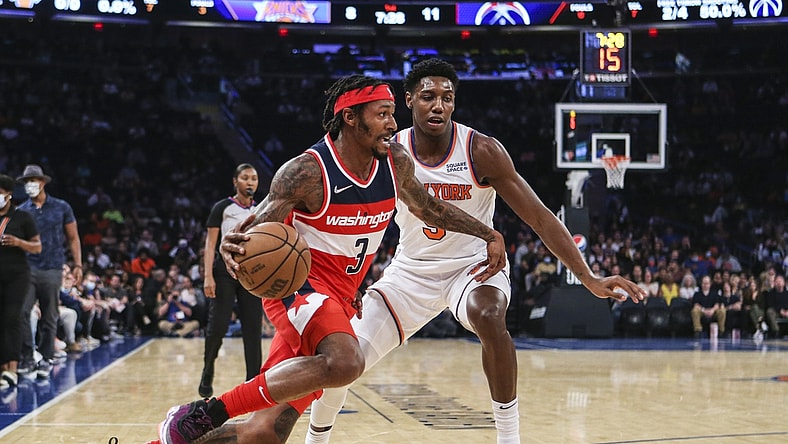 Oct 15, 2021; New York, New York, USA;  Washington Wizards guard Bradley Beal (3) drives past New York Knicks guard RJ Barrett (9) in the second quarter at Madison Square Garden. Mandatory Credit: Wendell Cruz-USA TODAY Sports