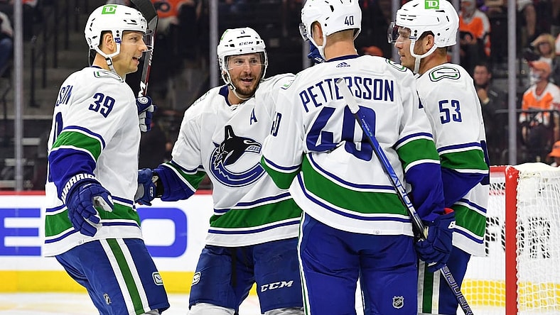 Oct 15, 2021; Philadelphia, Pennsylvania, USA; Vancouver Canucks center Elias Pettersson (40) celebrates his goal with teammates against the Philadelphia Flyers during the second period at Wells Fargo Center. Mandatory Credit: Eric Hartline-USA TODAY Sports