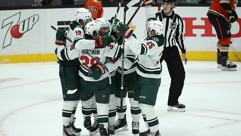 Oct 15, 2021; Anaheim, California, USA; Minnesota Wild left wing Marcus Foligno (17) (center) celebrates with teammates after scoring a game winning goal in the third period against the Anaheim Ducks at Honda Center. The Wild won 2-1. Mandatory Credit: Kiyoshi Mio-USA TODAY Sports