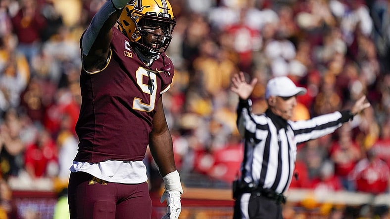 Oct 16, 2021; Minneapolis, Minnesota, USA;  Minnesota Golden Gophers defensive linemen Esezi Otomewo (9) celebrates a stop against the Nebraska Cornhuskers on fourth down during the fourth quarter at Huntington Bank Stadium. Mandatory Credit: Nick Wosika-USA TODAY Sports
