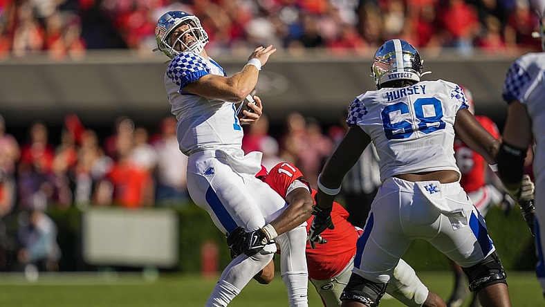 Oct 16, 2021; Athens, Georgia, USA; Kentucky Wildcats quarterback Will Levis (7) is tackled by Georgia Bulldogs linebacker Nakobe Dean (17) during the first half at Sanford Stadium. Mandatory Credit: Dale Zanine-USA TODAY Sports