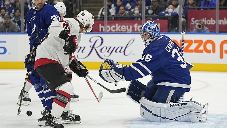 Oct 16, 2021; Toronto, Ontario, CAN; Ottawa Senators forward Tyler Ennis (63) and Toronto Maple Leafs defenseman Timothy Liljegren (37) and goaltender Jack Campbell (36) look for the puck during the first period at Scotiabank Arena. Mandatory Credit: John E. Sokolowski-USA TODAY Sports