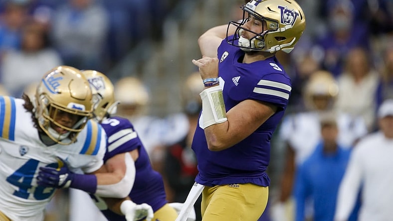Oct 16, 2021; Seattle, Washington, USA; Washington Huskies quarterback Dylan Morris (9) passes against the UCLA Bruins during the first quarter at Alaska Airlines Field at Husky Stadium. Mandatory Credit: Joe Nicholson-USA TODAY Sports