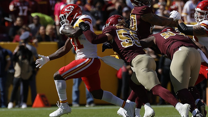 Oct 17, 2021; Landover, Maryland, USA; Kansas City Chiefs running back Darrel Williams (31) carries the ball as Washington Football Team linebacker Cole Holcomb (55) defends during the first quarter at FedExField. Mandatory Credit: Geoff Burke-USA TODAY Sports
