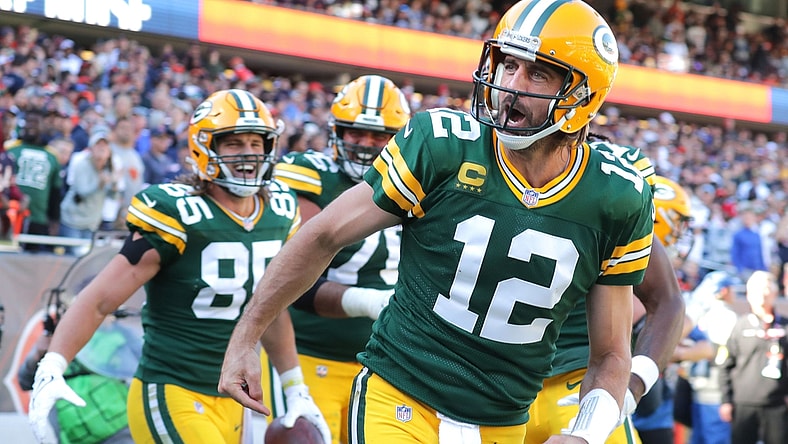 Aaron Rodgers celebrates his rushing touchdown during the fourth quarter against the Chicago Bears.Syndication Usa Today