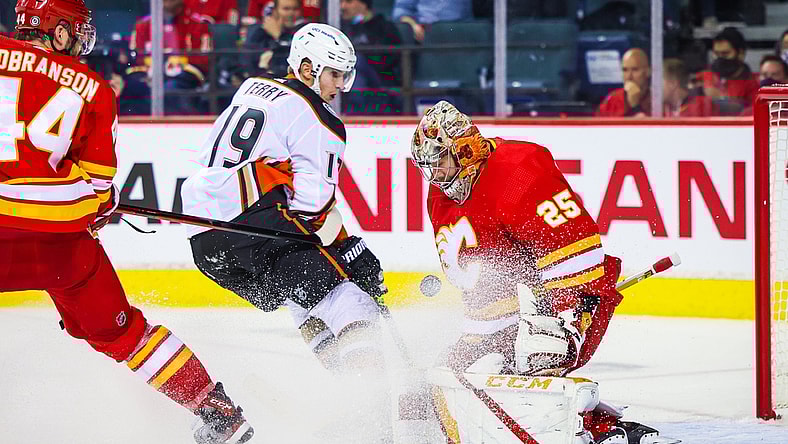 Oct 18, 2021; Calgary, Alberta, CAN; Calgary Flames goaltender Jacob Markstrom (25) makes a save against Anaheim Ducks center Troy Terry (19) during the second period at Scotiabank Saddledome. Mandatory Credit: Sergei Belski-USA TODAY Sports