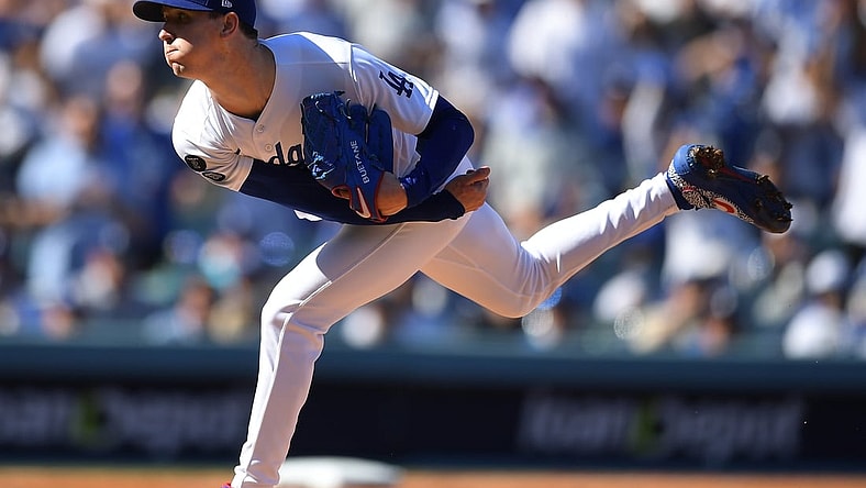 Oct 19, 2021; Los Angeles, California, USA; Los Angeles Dodgers starting pitcher Walker Buehler (21) throws during the first inning game three of the 2021 NLCS against the Atlanta Braves at Dodger Stadium. Mandatory Credit: Jayne Kamin-Oncea-USA TODAY Sports