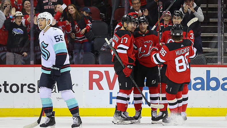 Oct 19, 2021; Newark, New Jersey, USA; The New Jersey Devils celebrate a goal by defenseman Damon Severson (28) during the first period of their game against the Seattle Kraken at Prudential Center. Mandatory Credit: Ed Mulholland-USA TODAY Sports