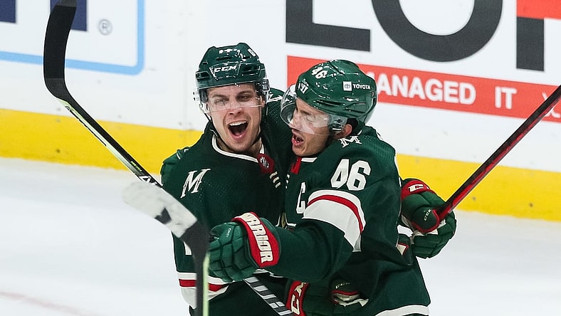 Oct 19, 2021; Saint Paul, Minnesota, USA; Minnesota Wild center Joel Eriksson Ek (14) celebrates with defenseman Jared Spurgeon (46) after scoring a goal against the Winnipeg Jets in the third period at Xcel Energy Center. Mandatory Credit: David Berding-USA TODAY Sports