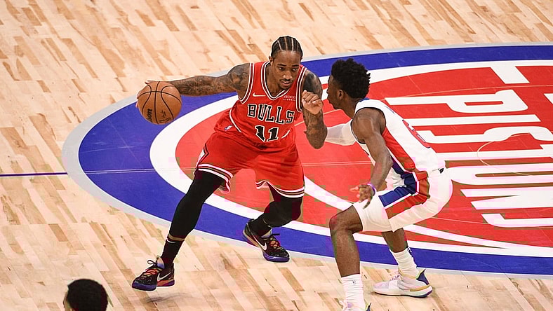 Oct 20, 2021; Detroit, Michigan, USA; Chicago Bulls forward DeMar DeRozan (11) drives to the basket as Detroit Pistons guard Hamidou Diallo (6) defends during the third quarter at Little Caesars Arena. Mandatory Credit: Tim Fuller-USA TODAY Sports