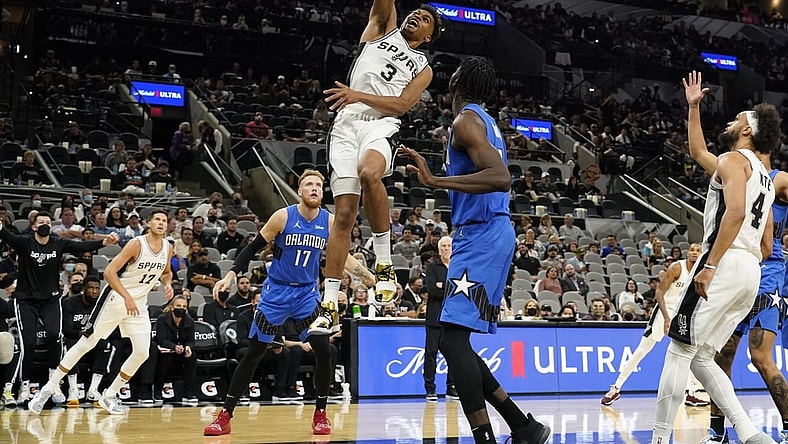 Oct 20, 2021; San Antonio, Texas, USA; San Antonio Spurs forward Keldon Johnson (3) dunks as Orlando Magic center Mo Bamba (5) looks on in the first half at AT&T Center. Mandatory Credit: Scott Wachter-USA TODAY Sports