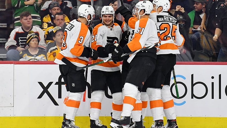 Oct 20, 2021; Philadelphia, Pennsylvania, USA; Philadelphia Flyers left wing Scott Laughton (21) celebrates with teammates after scoring a goal against the Boston Bruins during the second period at Wells Fargo Center. Mandatory Credit: Eric Hartline-USA TODAY Sports