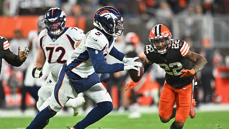 Oct 21, 2021; Cleveland, Ohio, USA; Denver Broncos quarterback Teddy Bridgewater (5) scrambles from Cleveland Browns defensive back Grant Delpit (22) during the first half at FirstEnergy Stadium. Mandatory Credit: Ken Blaze-USA TODAY Sports