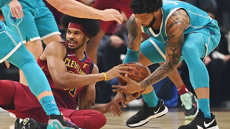 Oct 22, 2021; Cleveland, Ohio, USA; Charlotte Hornets forward Miles Bridges (0) and Cleveland Cavaliers center Jarrett Allen (31) go for a loose ball during the first quarter at Rocket Mortgage FieldHouse. Mandatory Credit: Ken Blaze-USA TODAY Sports