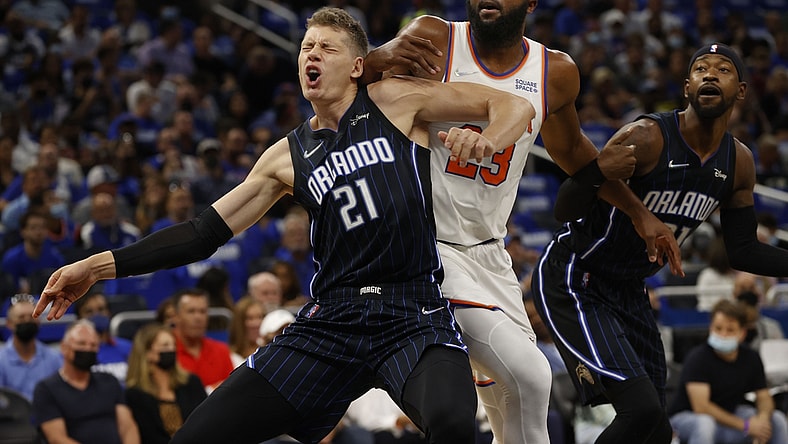 Oct 22, 2021; Orlando, Florida, USA; Orlando Magic center Moritz Wagner (21) and New York Knicks center Mitchell Robinson (23) defend to go after the ball during the first quarter at Amway Center. Mandatory Credit: Kim Klement-USA TODAY Sports