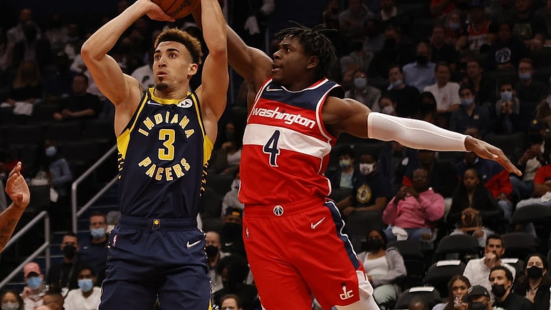 Oct 22, 2021; Washington, District of Columbia, USA; Washington Wizards guard Aaron Holiday (4) blocks the shot of Indiana Pacers guard Chris Duarte (3) during the first quarter at Capital One Arena. Mandatory Credit: Geoff Burke-USA TODAY Sports