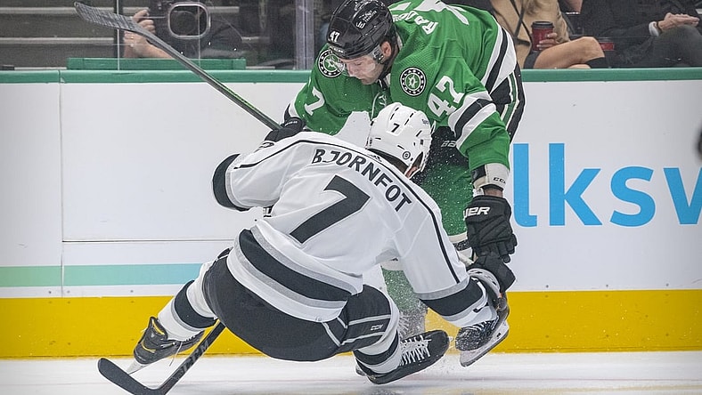 Oct 22, 2021; Dallas, Texas, USA; Dallas Stars right wing Alexander Radulov (47) and Los Angeles Kings defenseman Tobias Bjornfot (7) chase the puck during the second period at the American Airlines Center. Mandatory Credit: Jerome Miron-USA TODAY Sports
