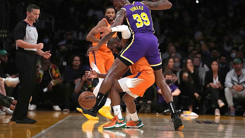 Oct 22, 2021; Los Angeles, California, USA; Phoenix Suns guard Chris Paul (3) is defended by Los Angeles Lakers center Dwight Howard (39) in the first half at Staples Center. Mandatory Credit: Kirby Lee-USA TODAY Sports