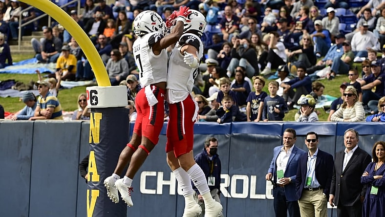 Oct 23, 2021; Annapolis, Maryland, USA; Cincinnati Bearcats tight end Josh Whyle (81)  celebrates with  wide receiver Tre Tucker (7) after scoring a first quarter touchdown against the Navy Midshipmen  at Navy-Marine Corps Memorial Stadium. Mandatory Credit: Tommy Gilligan-USA TODAY Sports