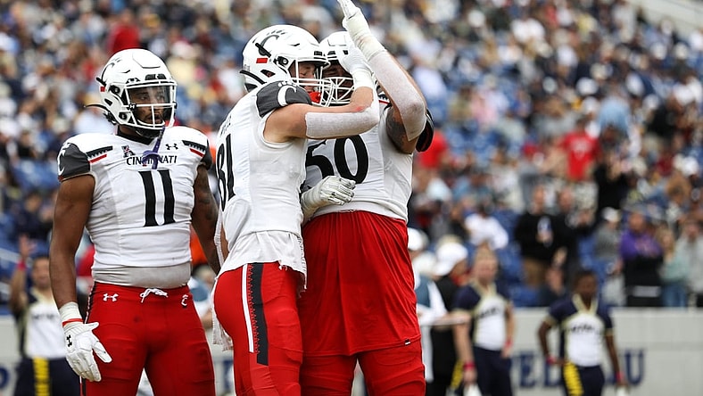 UC's Josh Whyle (81) celebrates with the team after scoring another touchdown during the second half of the UC Bearcat vs. Navy Midshipmen game at Navy-Marine Corps Memorial Stadium on Saturday October 23, 2021. UC won the game with a final score of 27-20.
