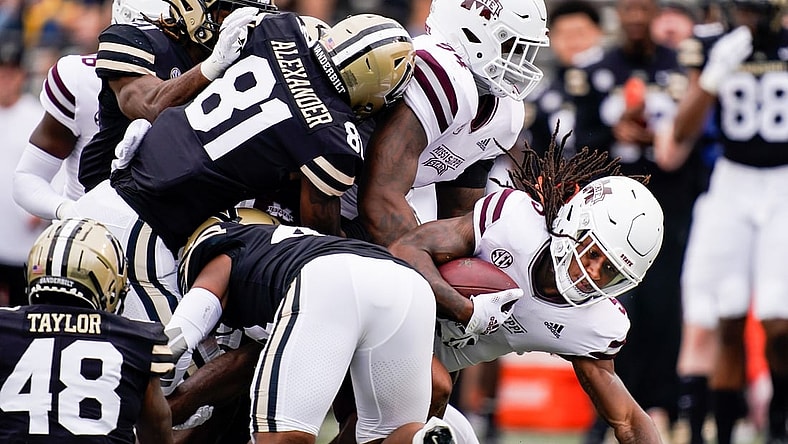 Mississippi State wide receiver Lideatrick Griffin (5) is brought down by Vanderbilt defenders during the first quarter at Vanderbilt Stadium in Nashville, Tenn., Saturday, Oct. 23, 2021.

Vandy Missst Fb 102321 An 010