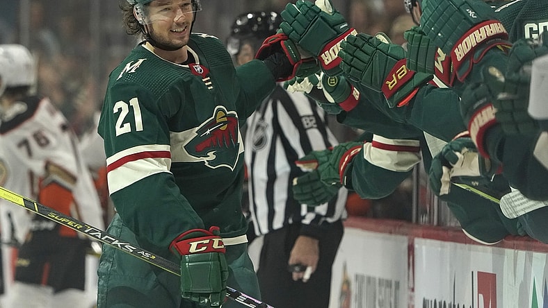 Oct 23, 2021; Saint Paul, Minnesota, USA;  Minnesota Wild forward Brandon Duhaime (21) celebrates after scoring a goal against the Anaheim Ducks during the first period at Xcel Energy Center. Mandatory Credit: Nick Wosika-USA TODAY Sports