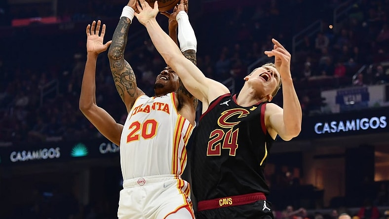 Oct 23, 2021; Cleveland, Ohio, USA; Atlanta Hawks forward John Collins (20) goes for a rebound against Cleveland Cavaliers forward Lauri Markkanen (24) during the first half at Rocket Mortgage FieldHouse. Mandatory Credit: Ken Blaze-USA TODAY Sports