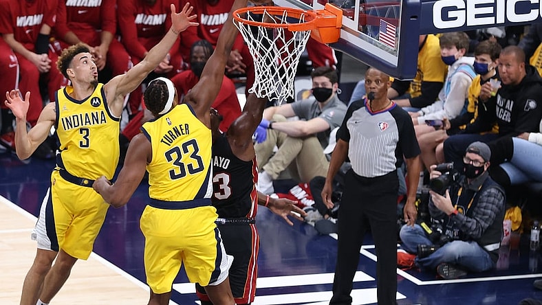 Oct 23, 2021; Indianapolis, Indiana, USA; Indiana Pacers center Myles Turner (33) blocks a shot by Miami Heat center Bam Adebayo (13) during the first half at Gainbridge Fieldhouse. Mandatory Credit: Robert Meyer-USA TODAY Sports
