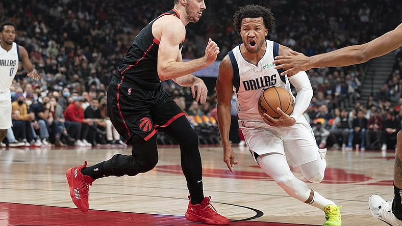 Oct 23, 2021; Toronto, Ontario, CAN; Dallas Mavericks guard Jalen Brunson (13) drives to the basket against Toronto Raptors guard Goran Dragic (1) during the first quarter at Scotiabank Arena. Mandatory Credit: Nick Turchiaro-USA TODAY Sports