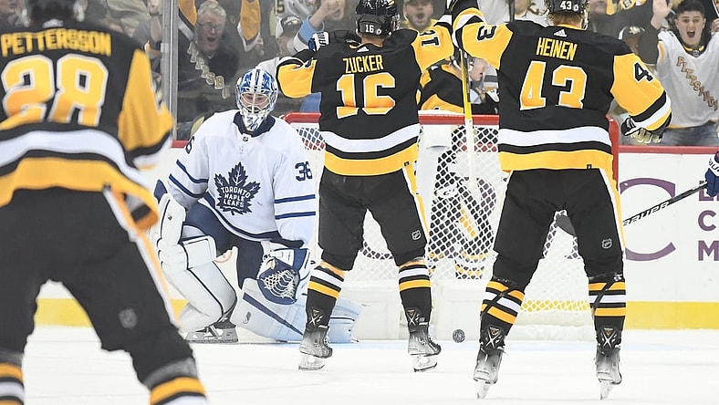 Oct 23, 2021; Pittsburgh, Pennsylvania, USA; Pittsburgh Penguins left wing Jason Zucker (16) and left wing Danton Heinen (43) celebrate after a second period goal against Toronto Maple Leafs goalie Jack Campbell (36) at PPG Paints Arena. Mandatory Credit: Philip G. Pavely-USA TODAY Sports