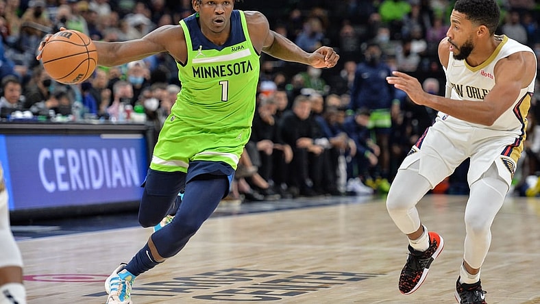 Oct 23, 2021; Minneapolis, Minnesota, USA; Minnesota Timberwolves forward Anthony Edwards (1) drives past New Orleans Pelicans guard Garrett Temple (41) during the second quarter at Target Center. Mandatory Credit: Jeffrey Becker-USA TODAY Sports
