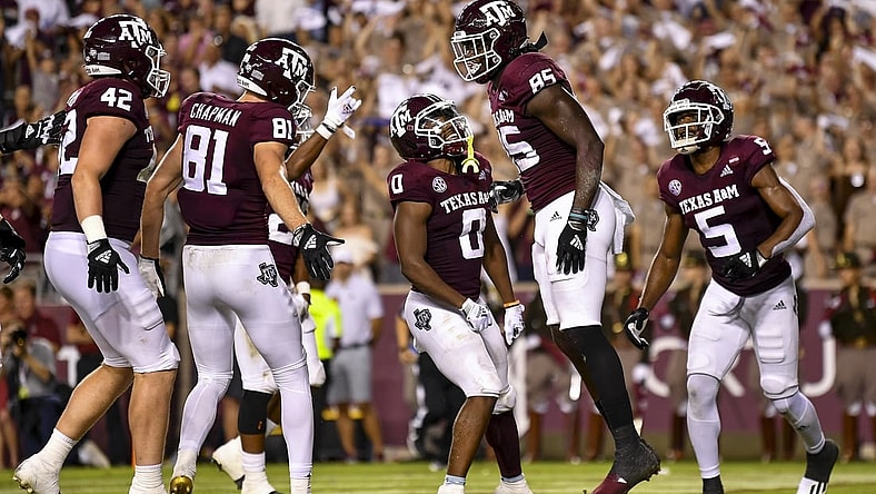 Oct 23, 2021; College Station, Texas, USA;  Texas A&M Aggies tight end Jalen Wydermyer (85) celebrates his touchdown with Texas A&M Aggies wide receiver Jalen Preston (5), Texas A&M Aggies wide receiver Ainias Smith (0), during the first quarter against the South Carolina Gamecocks at Kyle Field. Mandatory Credit: Maria Lysaker-USA TODAY Sports