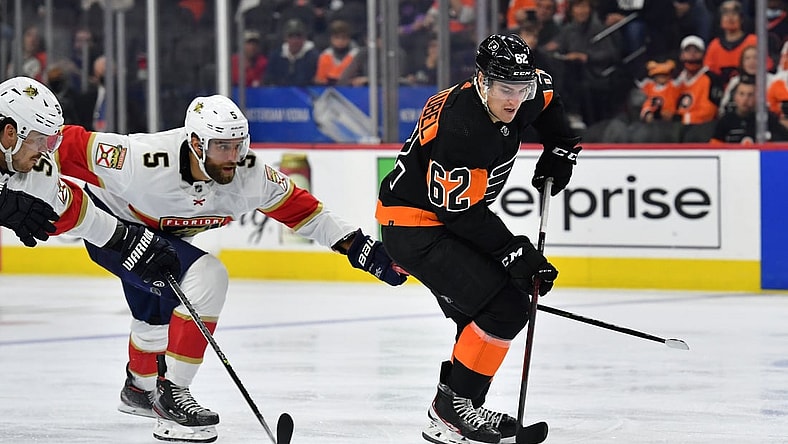 Oct 23, 2021; Philadelphia, Pennsylvania, USA; Philadelphia Flyers right wing Nicolas Aube-Kubel (62) carries the puck against Florida Panthers defenseman Aaron Ekblad (5) during the third period at Wells Fargo Center. Mandatory Credit: Eric Hartline-USA TODAY Sports