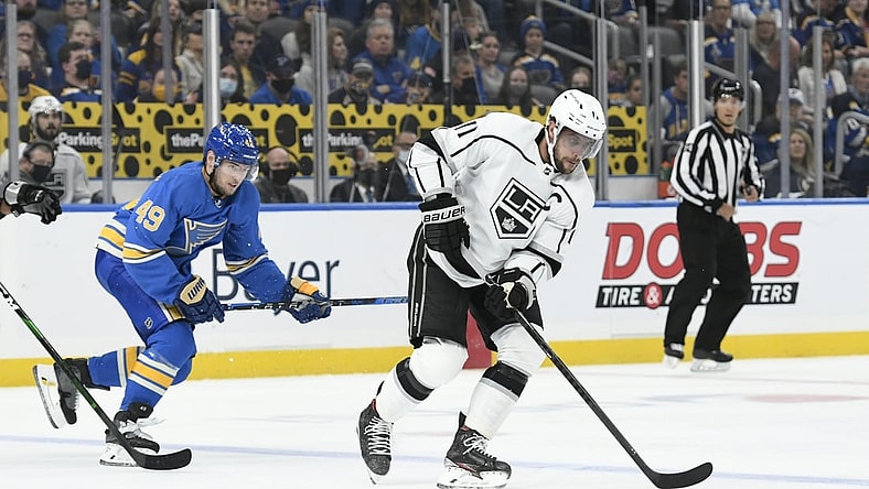 Oct 23, 2021; St. Louis, Missouri, USA; Los Angeles Kings center Anze Kopitar (11) controls the puck from St. Louis Blues center Ivan Barbashev (49) in the first period at Enterprise Center. Mandatory Credit: Jeff Le-USA TODAY Sports