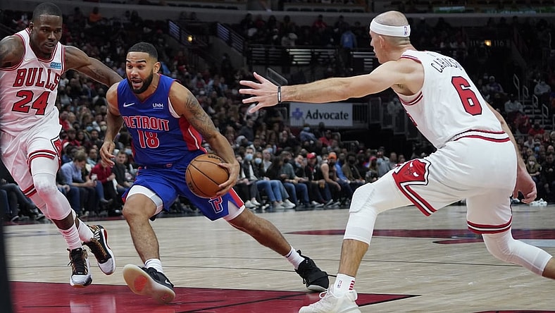Oct 23, 2021; Chicago, Illinois, USA; Detroit Pistons guard Cory Joseph (18) is defended by Chicago Bulls guard Javonte Green (24) and guard Alex Caruso (6) during the second half at United Center. Mandatory Credit: David Banks-USA TODAY Sports