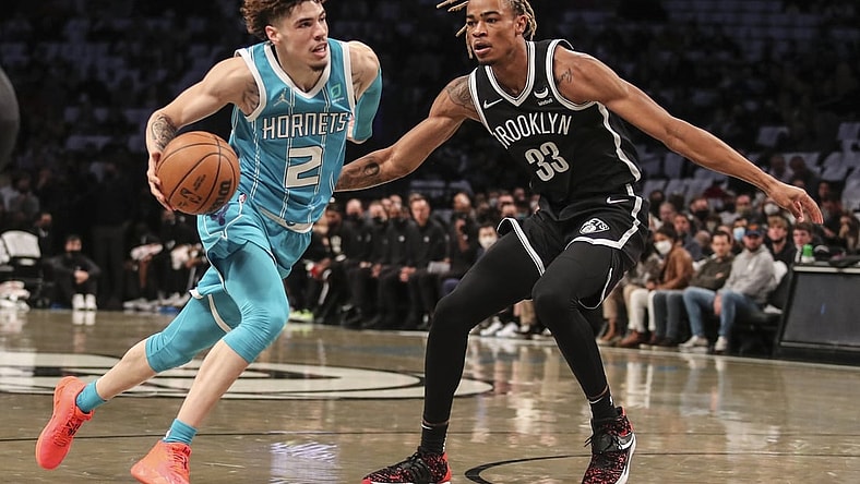 Oct 24, 2021; Brooklyn, New York, USA;  Charlotte Hornets guard LaMelo Ball (2) drives past Brooklyn Nets forward Nic Claxton (33) in the first quarter at Barclays Center. Mandatory Credit: Wendell Cruz-USA TODAY Sports